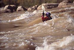 Kayaker negotiating Tanner Rapids, Colorado River, Grand Canyon National Park  (c) Rob Kleine, All Rights Reserved.  www.gentleye.com